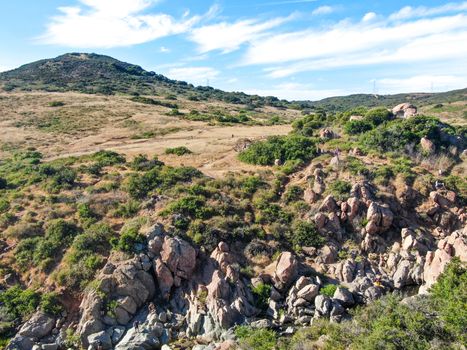 Aerial view of Los Penasquitos Canyon Preserve with the creek waterfall and people enjoying the water. Urban park with trails and river in San Diego, California. USA