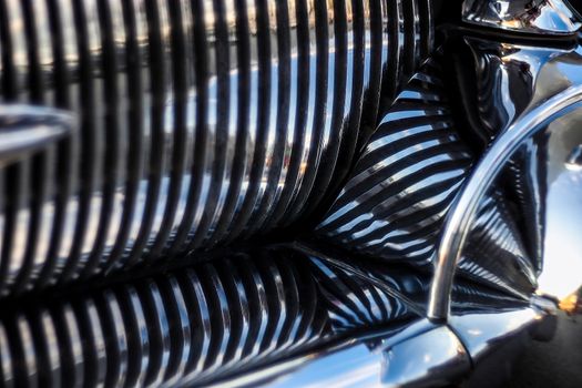 Colorful abstract background retro car. Metal close-up texture background. Soft focus, boke background with copy space. Close up image of a metal car grill.