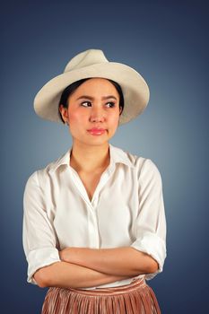 Pretty asian teenager with an impatience and bored expression on white background 