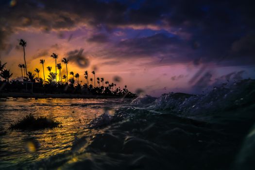 Beautiful cloudscape over the sea, sunset shot. Aerial view over the sea, sunset shot. Colorful clouds in sunrise over Atlantic Ocean coast. Bavaro beach. Hispaniola Island. Dominican Republic, coastal landscape.