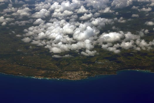 Beautiful aerial view from the plane over Punta Cana, Dominican Republic. Flying above the clouds. View from the airplane.