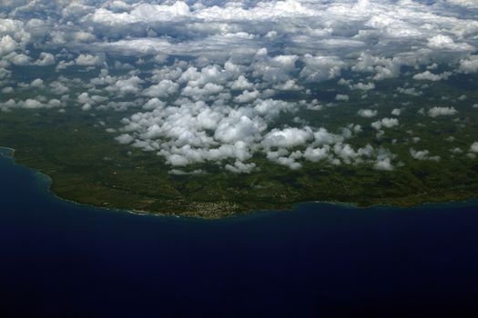 Beautiful aerial view from the plane over Punta Cana, Dominican Republic. Flying above the clouds. View from the airplane.