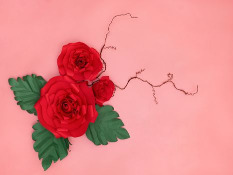 Red paper roses and tiny twigs in salmon pink background.