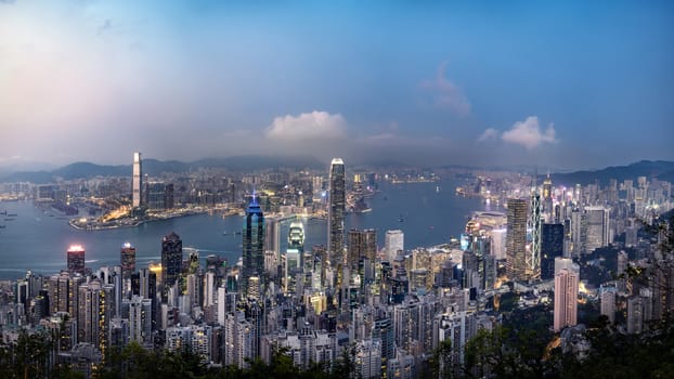 Panorama view of Hong Kong skyline on the evening seen from Victoria peak, Hong Kong, China.