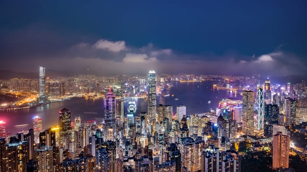 Panorama view of Hong Kong skyline on the evening seen from Victoria peak, Hong Kong, China.