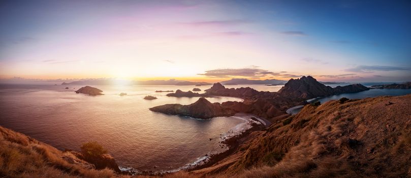 Panoramic scenic view of Padar Island during sunset with dramatic sky, Palau Padar, Komodo National Park, Indonesia