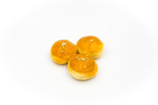 Three Chinese pastries placed on a white background.