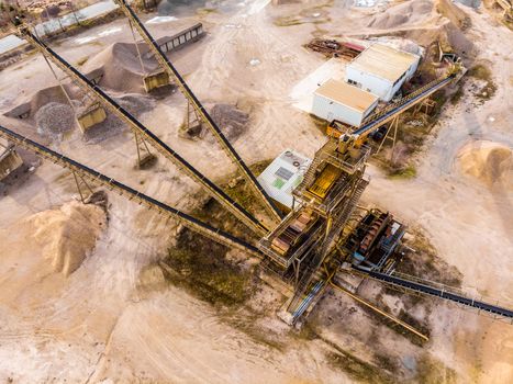Oblique aerial photograph with a view of a large processing machine when used in a sand quarry, to divide the dredged material into different fractions, drone shot