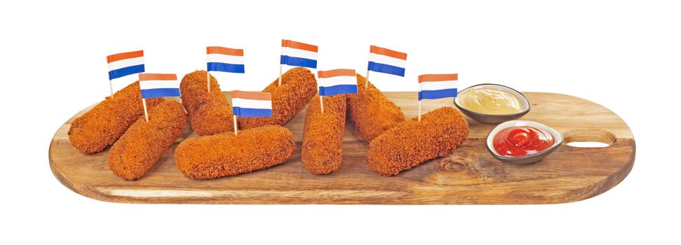 Brown crusty dutch kroketten on a serving tray, isolated on a white background