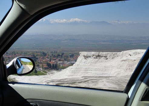 View through the window of a car to the travertine terraces of Pamukkale, Anatolia, Turkey