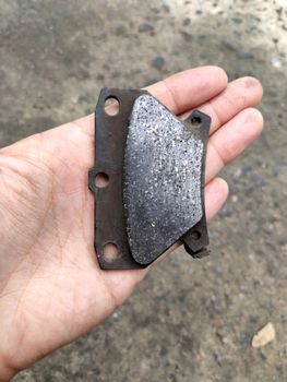 close up to brake pad in brake of the car