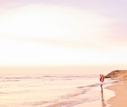 Girl and the sea at sunrise, travel and beach lifestyle concept