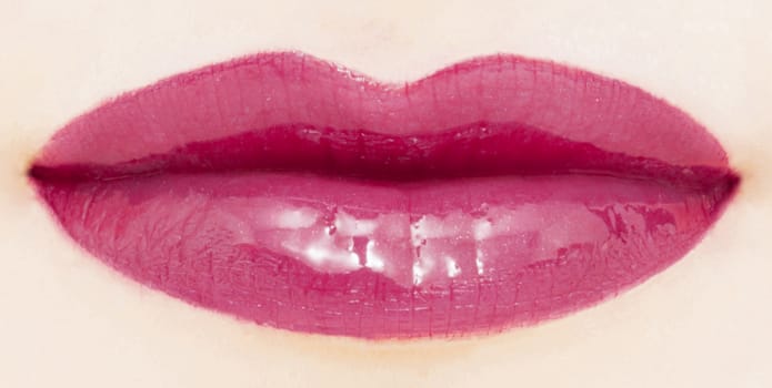 Female lips with glossy lipstick or lip gloss for make-up and beauty ads