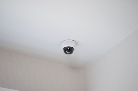 home security camera set up indoor at home and office. Security Camera on the wall.  
