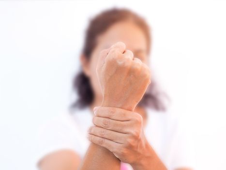 adult asian woman with wrist pain from rheumatology and osteoporosis