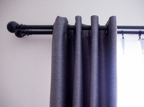 Gray curtains with slide rails on the top