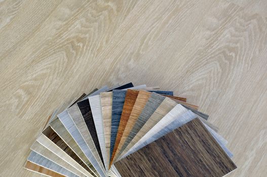 Wood material. Sample of wood laminate, veneer, vinyl texture. wood background. Home renovate floor with vinyl tile. copyspace for text background.