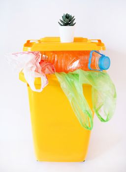 save the earth and environment concept with Yellow trash Recycling bins