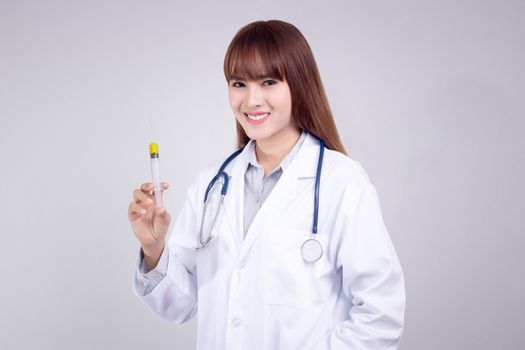 Healthy concept : Young Asian doctor with hypodermic syringe in hand