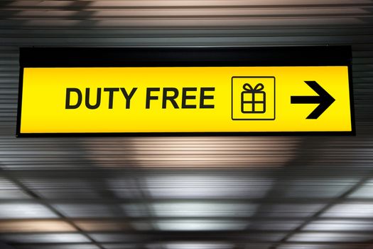 Duty Free shopping sign hanging from ceiling from airport terminal