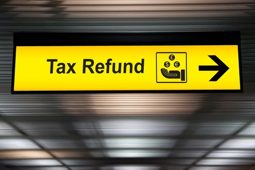 Tax refund sign hanging from the ceiling at the airport