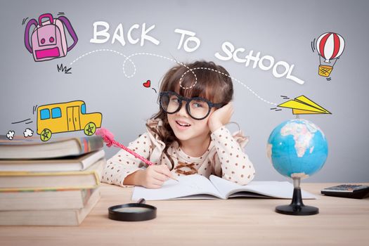 back to school  concept. cute little girl wear glasses do homework at home with word back to school and cute cartoon on head. learning, teaching and education educate children