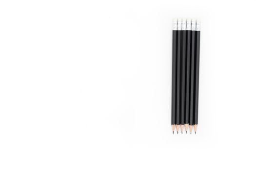6 pencils on the right side of the image on a white background
