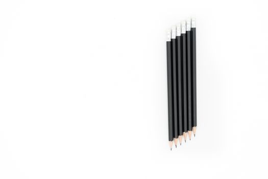 6 pencil placed diagonally to the right of the picture on a white background