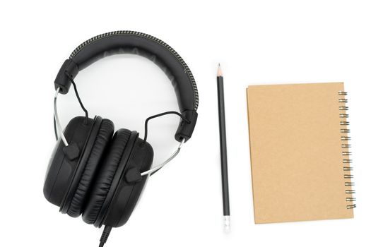 There are brown books on the right side of the picture, black pencil in the middle of the picture and black headphones on the left of all pictures on a white background.