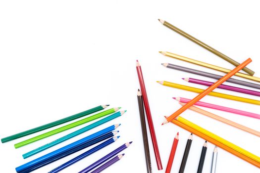 24 wooden colors spread over a white background on the bottom right of the image