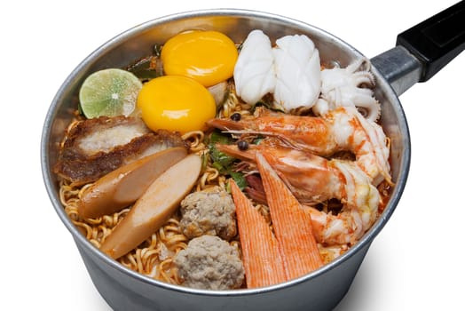 Bowl of spicy instant noodles isolated on white background. Topping with eggs, lemon, pork , crispy pork, sausage, shrimp, squid, crab and coriander