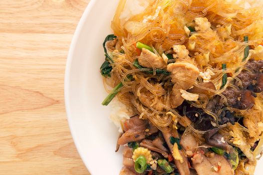 Sweet vermicelli fried with vegetable and chicken on rice