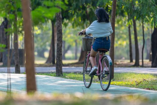 Bangkok, Thailand - March 15, 2017 : Unidentified people riding a bicycle by cycling on a bicycle lane in a outdoor park for exercise healthy