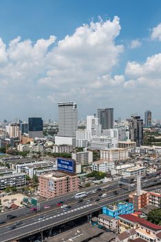 Bangkok, Thailand - April 8, 2017 : Cityscape and transportation with expressway and traffic in daytime from skyscraper of Bangkok. Bangkok is the capital and the most populous city of Thailand.