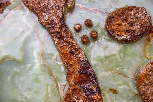 Close up of the texture and patterns of a cut raw jade rock