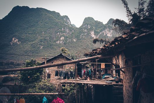 Stilted mud and wood houses of Khuoi Ky rock village built on the karst mountains  in Cao Bang Vietnam shows the old traditions and lifestyle of Vietnamese people