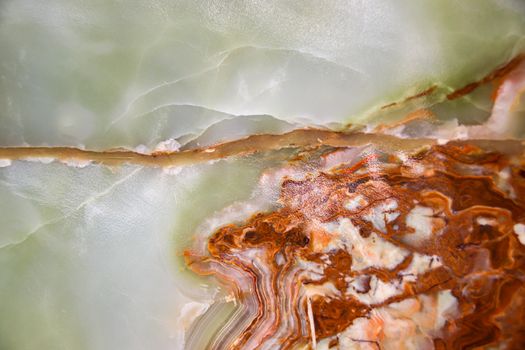 Close up of the texture and patterns of a cut raw jade rock