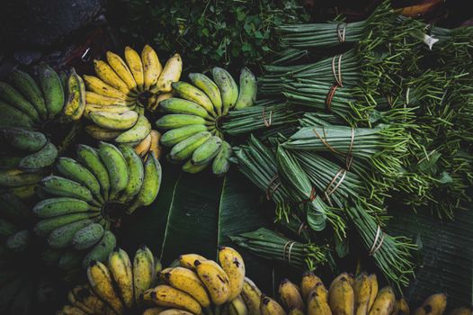 Betel leaves and fresh bananas sold in the local morning market in Luang Prabang, Laos