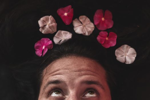 Conceptual photo of man with a flower crown showing concept of Spring, sexuality, lgbtq community and pride month celebration