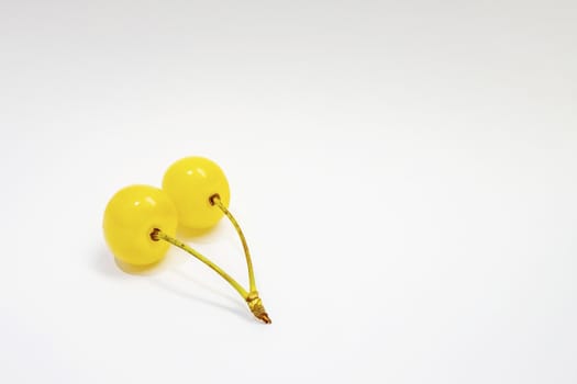 yellow cherry on a white background