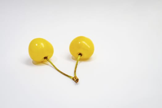 yellow cherry on a white background