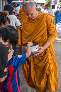 Chanthaburi, Thailand - July 9, 2017 : Unidentified Thai buddhism people in buddhist pray by Kathin Ceremony to make and off-season offering of robes and other needs to monks at Thai temple (Wat Thai)