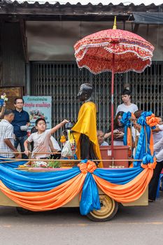 Chanthaburi, Thailand - July 9, 2017 : Unidentified Thai buddhism people in buddhist pray by Kathin Ceremony to make and off-season offering of robes and other needs to monks at Thai temple (Wat Thai)