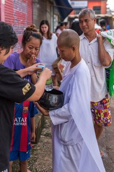 Chanthaburi, Thailand - July 9, 2017 : Unidentified Thai buddhism people in buddhist pray by Kathin Ceremony to make and off-season offering of robes and other needs to monks at Thai temple (Wat Thai)