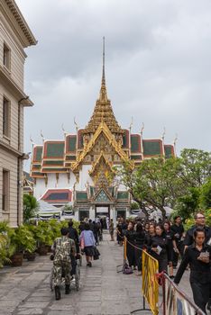 Bangkok, Thailand - August 25, 2017 : Unidentified Thai mourners wearing black color waiting in The Grand Palace to pay tribute and respect to their beloved Rama 9 Thai King Bhumibol Adulyadej