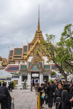 Bangkok, Thailand - August 25, 2017 : Unidentified Thai mourners wearing black color waiting in The Grand Palace to pay tribute and respect to their beloved Rama 9 Thai King Bhumibol Adulyadej