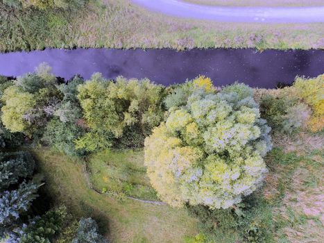 Path, stream and meadow from the air with the drone photographed, abstract and background