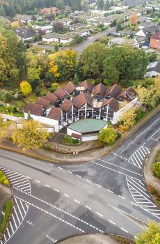 Modern terraced house with central forecourt in a suburb of Germany, aerial view with drone, taken at a slanting angle