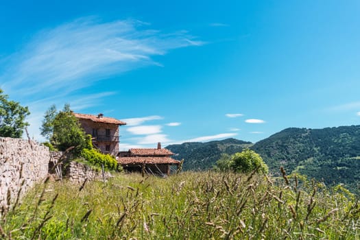 Abandoned house in the mountains. Stone house with views of the Pyrenees