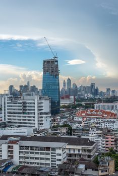 Bangkok, Thailand - May 25, 2018 : Cityscape and building of city in storm clouds sky from skyscraper of Bangkok. Bangkok is the capital and the most populous city of Thailand.